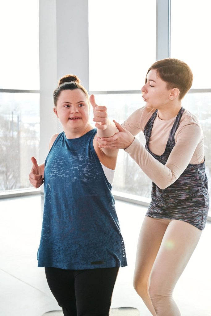 down syndrome woman learning yoga